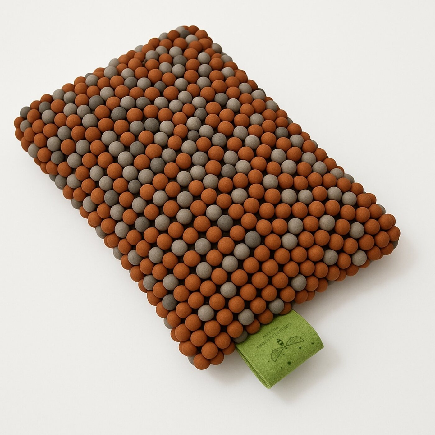 The Green Laundry Pillow — a soft pouch filled with mineral ceramic balls